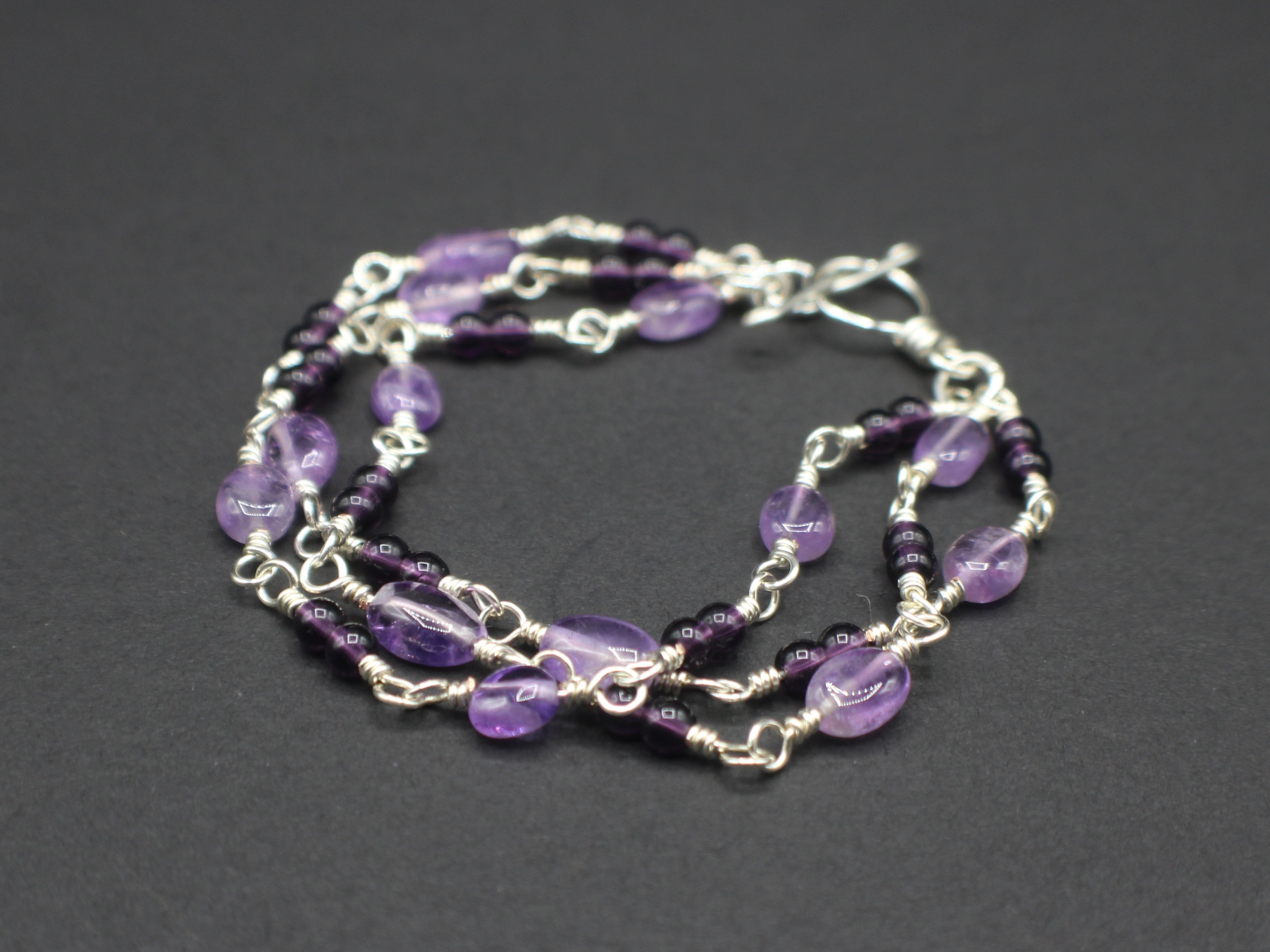 Handcrafted Triple Strand Amethyst and Glass Bracelet in Silver Plated Copper, 6.75"