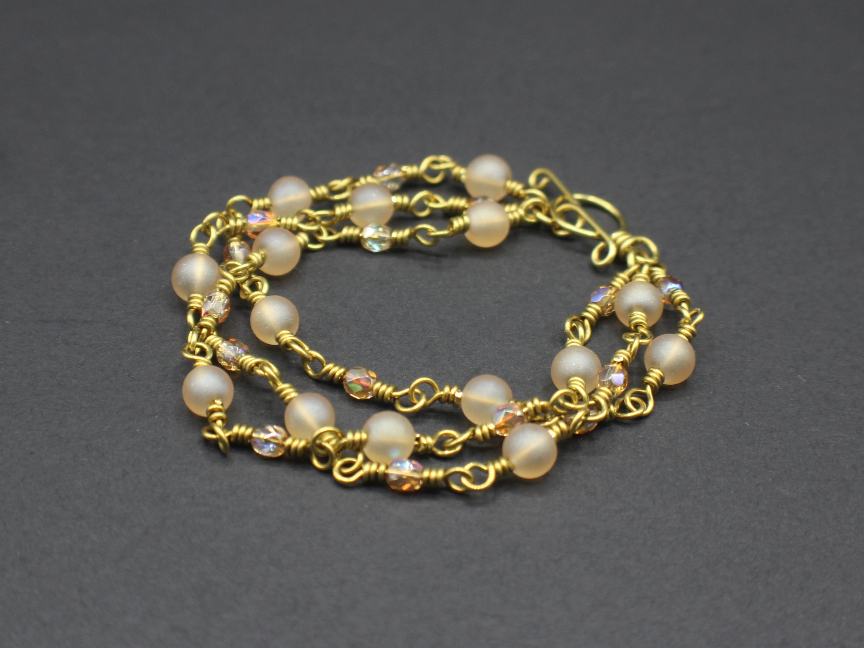 Handcrafted Triple Strand Frosted Glass and Faceted Bead Bracelet in Brass, 6.5"