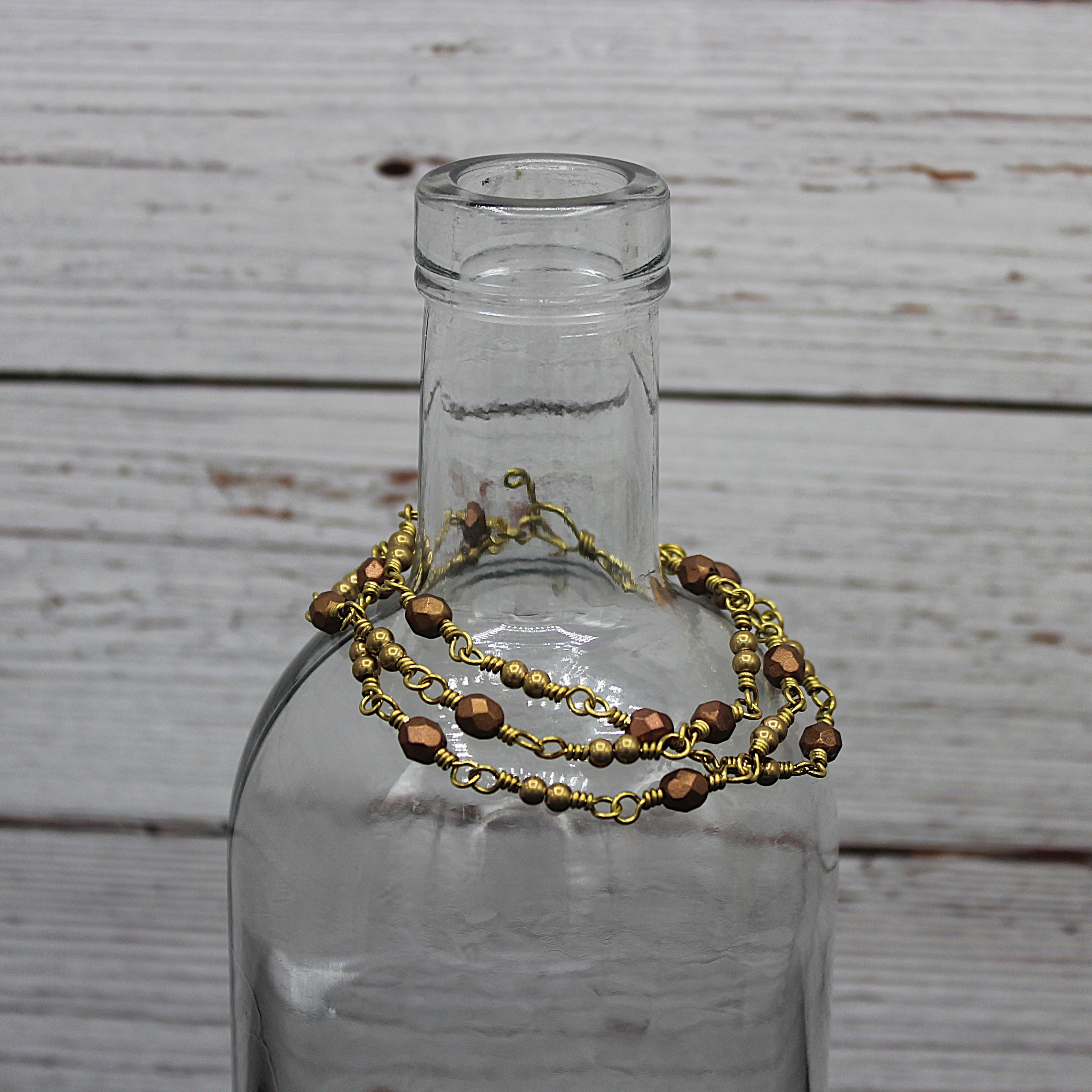 Handcrafted Triple Strand Metallic Faceted Glass and Brass Bracelet with Toggle Clasp, 6.5"