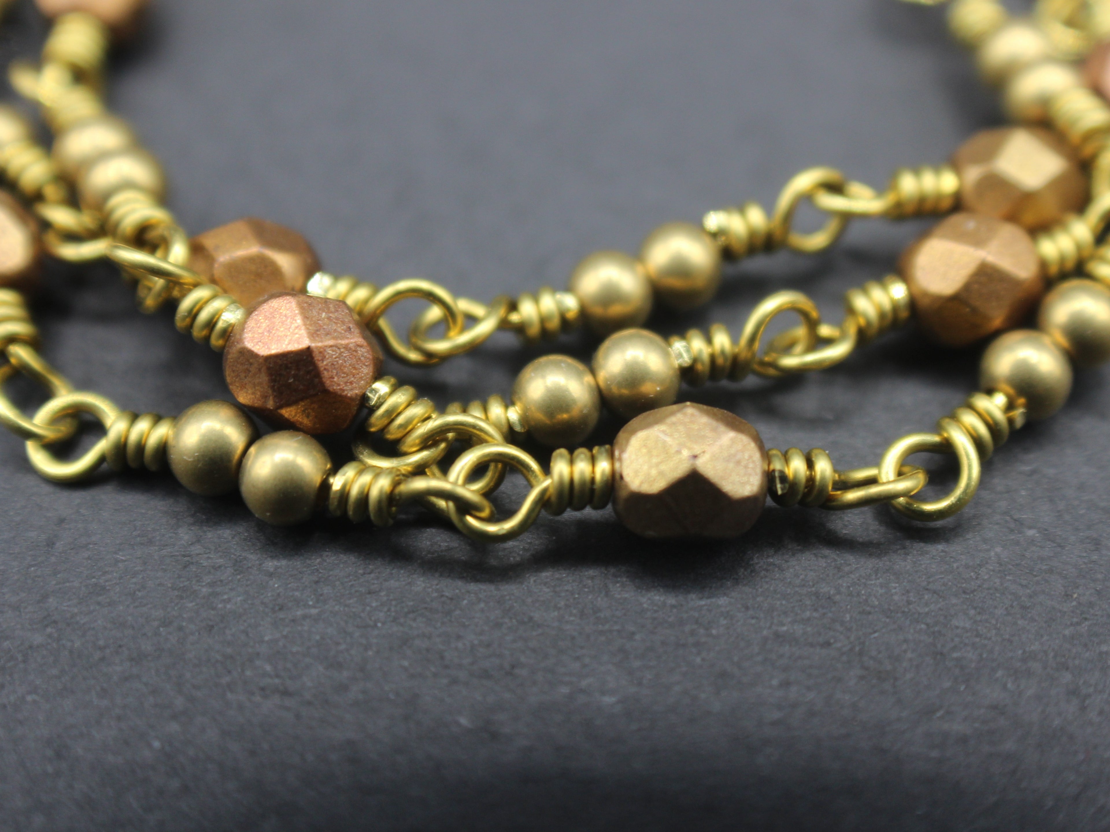 Handcrafted Triple Strand Metallic Faceted Glass and Brass Bracelet with Toggle Clasp, 6.5"