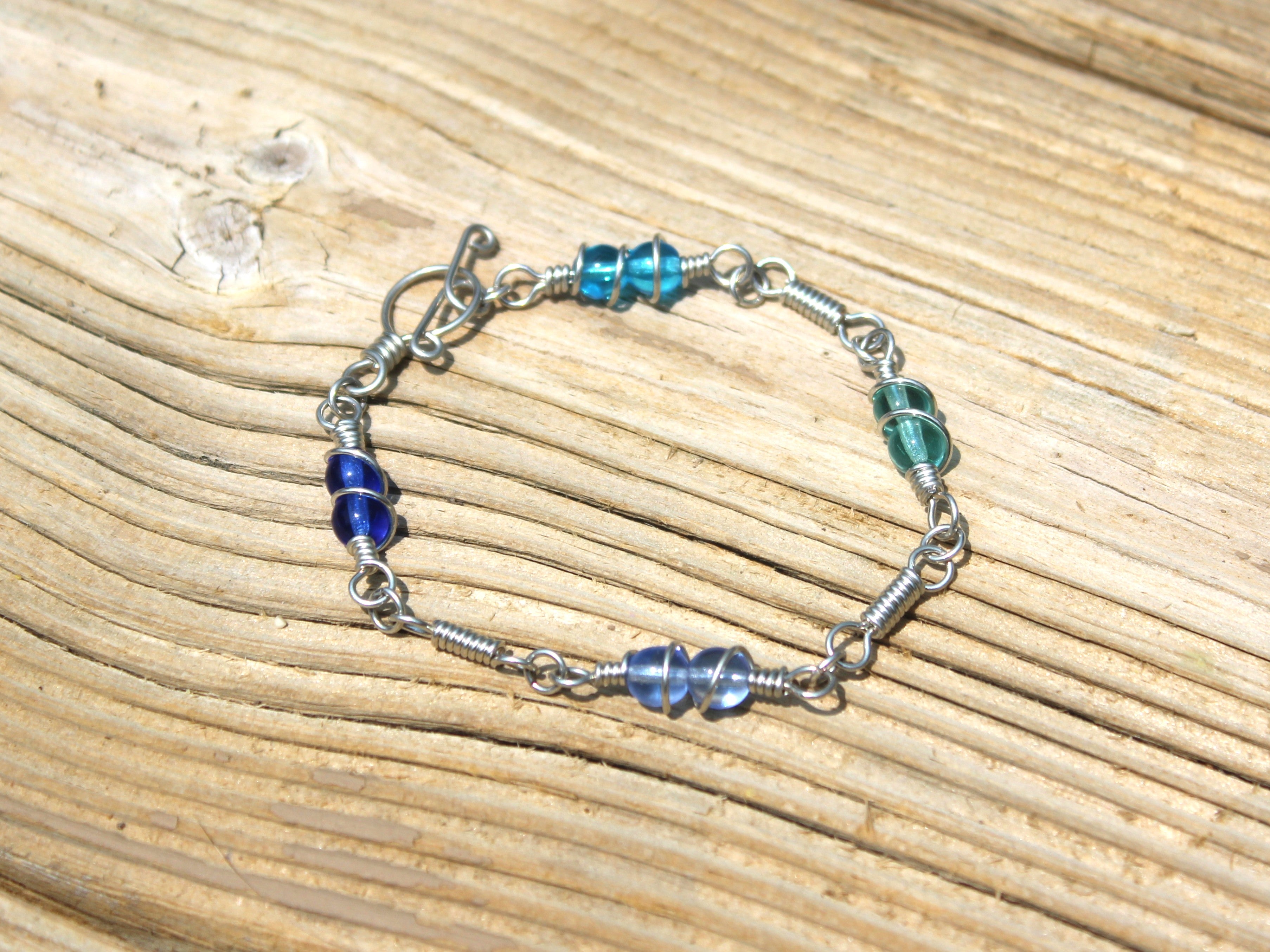 Handcrafted Single Strand Czech Glass Bracelet in Blue and Green with Spiral Wraps, 6.75"