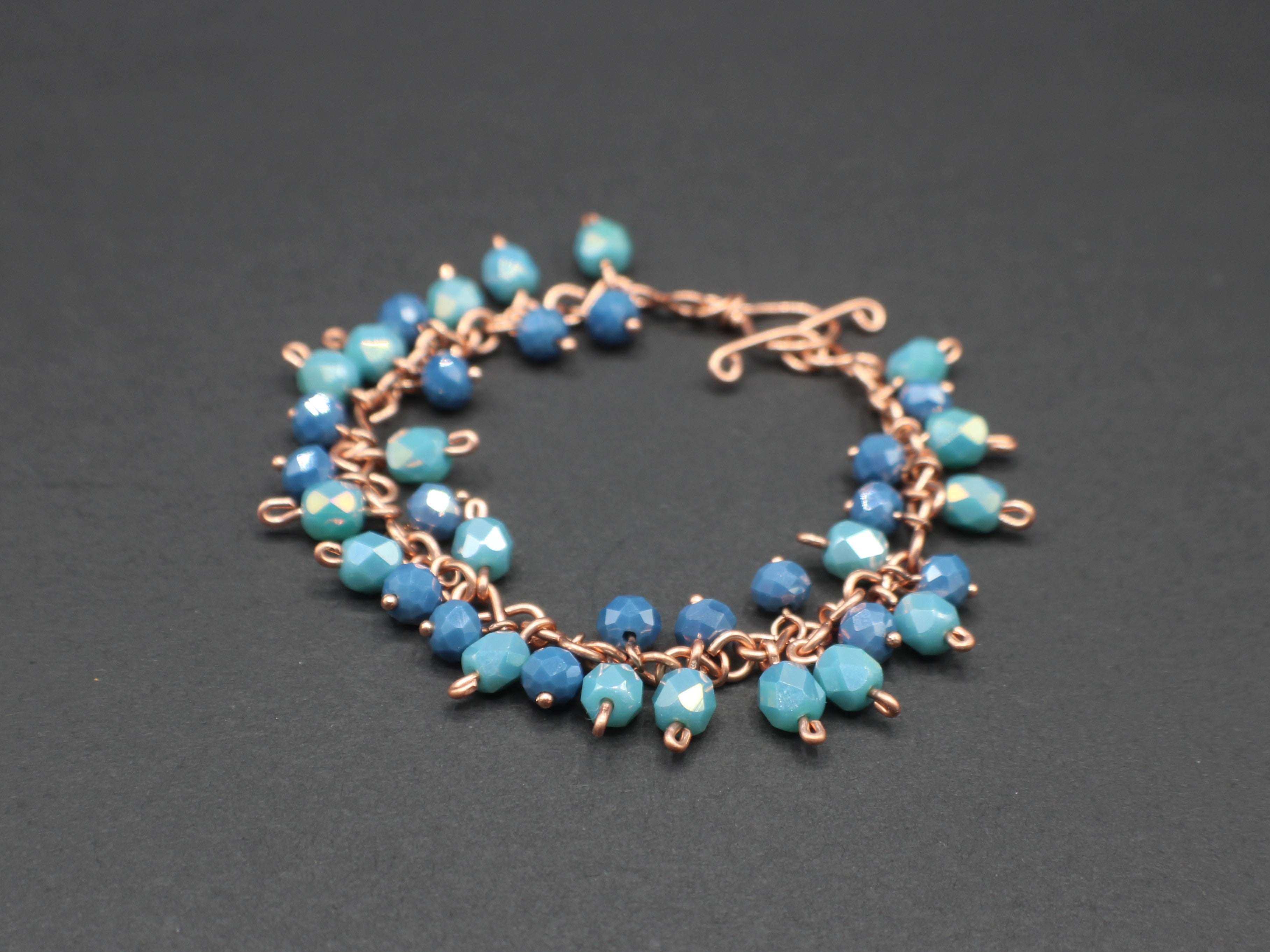 Handcrafted Blue and Aqua Faceted Glass Dangle Bracelet in Copper, 7.00"